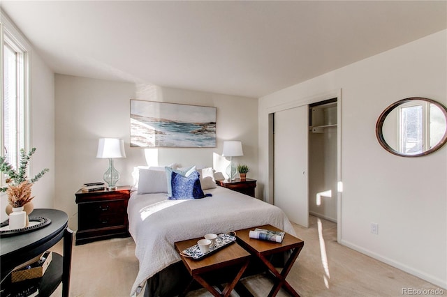 carpeted bedroom featuring a closet