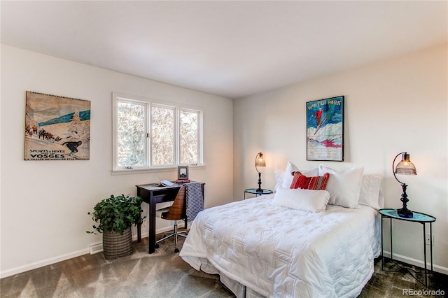 bedroom with dark colored carpet