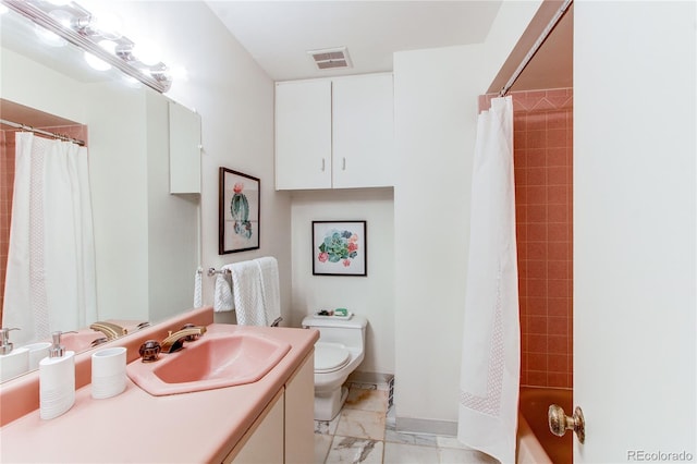 full bathroom with vanity, shower / bath combo, and toilet