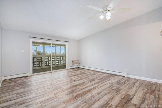 unfurnished room with lofted ceiling, a baseboard heating unit, light wood-type flooring, and ceiling fan