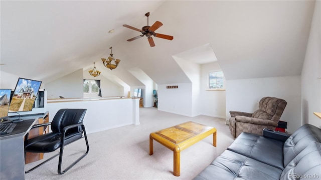 office area featuring light carpet, ceiling fan, baseboards, and lofted ceiling