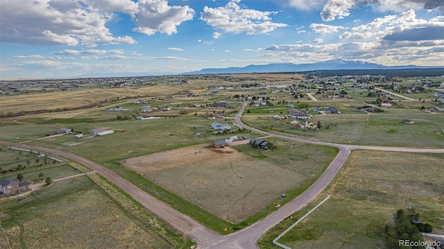 drone / aerial view featuring a mountain view