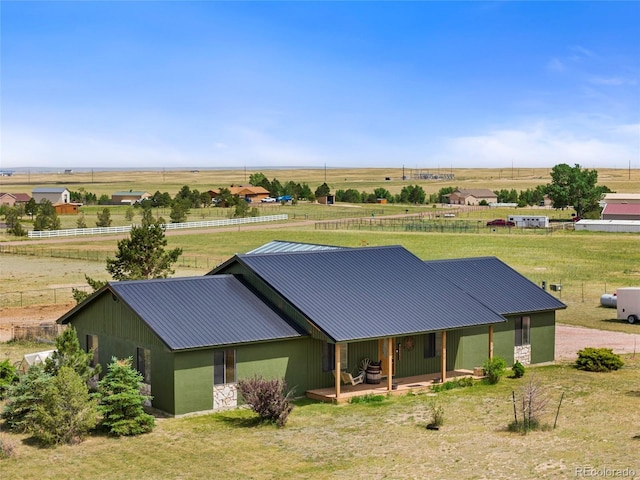 view of front of property with a rural view