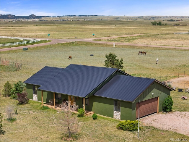 bird's eye view featuring a mountain view and a rural view