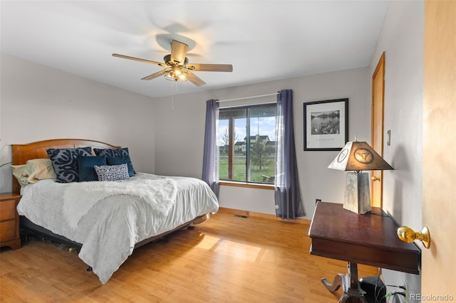 bedroom featuring hardwood / wood-style floors and ceiling fan