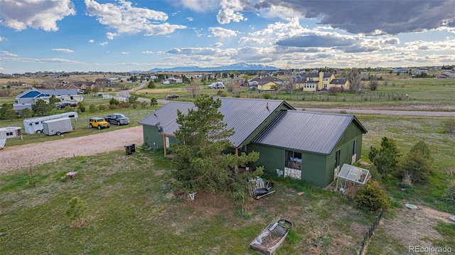 birds eye view of property featuring a mountain view