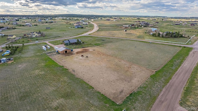 birds eye view of property with a rural view