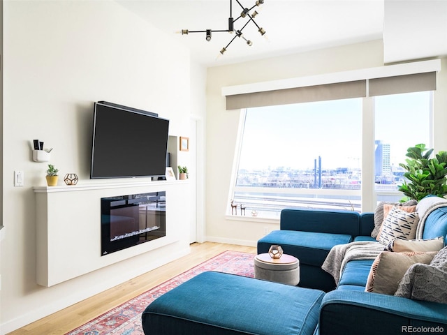 living room with hardwood / wood-style flooring and a chandelier