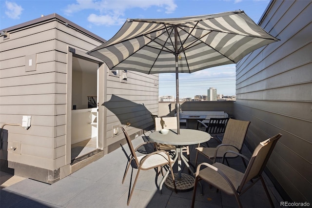 view of patio featuring outdoor dining area