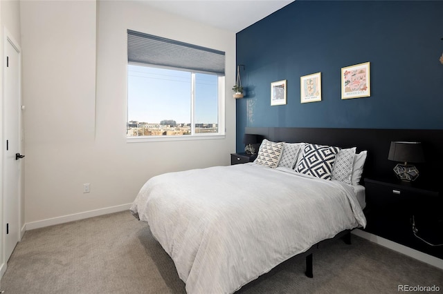 bedroom with carpet floors and baseboards