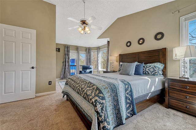 carpeted bedroom featuring access to exterior, baseboards, ceiling fan, lofted ceiling, and a textured ceiling