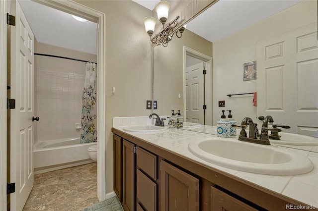 bathroom with a sink, toilet, double vanity, and shower / tub combo