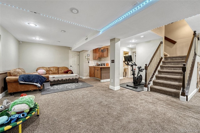 living area featuring stairway, light colored carpet, and baseboards