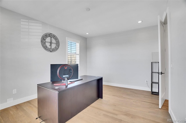 office space with light hardwood / wood-style floors