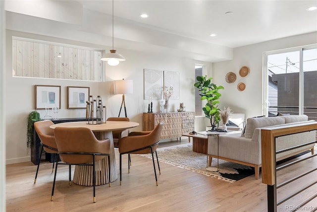 dining area featuring a wealth of natural light and light hardwood / wood-style floors