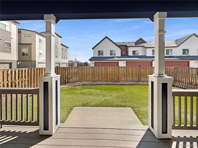 view of yard featuring a residential view and fence