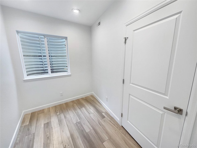 empty room with visible vents, recessed lighting, baseboards, and light wood-style floors