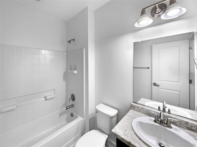 bathroom featuring toilet, vanity, and washtub / shower combination