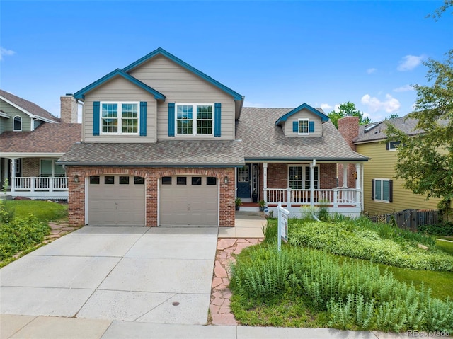 18 Blue Sage, Littleton, CO 80127 - view of front of house featuring a porch, brick siding, concrete driveway, and a garage