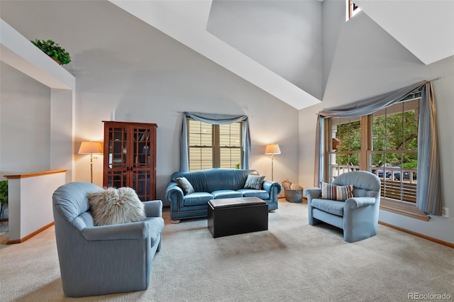 18 Blue Sage, Littleton, CO 80127 - carpeted living area featuring high vaulted ceiling and plenty of natural light