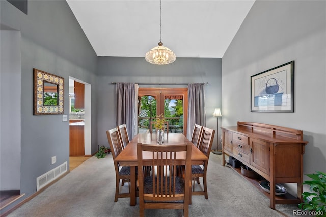 18 Blue Sage, Littleton, CO 80127 - carpeted dining area featuring a chandelier and high vaulted ceiling