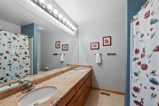 18 Blue Sage, Littleton, CO 80127 - full bathroom with double vanity, a shower with curtain, and tile patterned floors