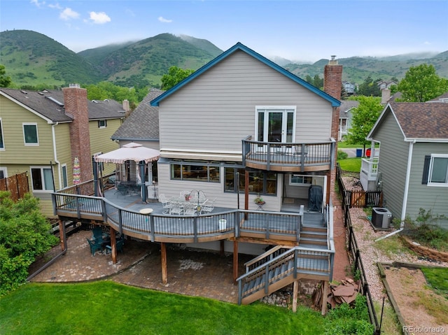18 Blue Sage, Littleton, CO 80127 - back of house with a deck with mountain view, a gazebo, and outdoor dining area