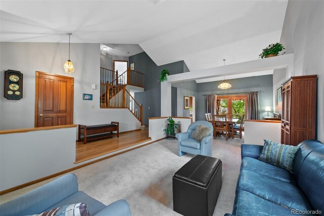 18 Blue Sage, Littleton, CO 80127 - living room featuring high vaulted ceiling, carpet flooring, and stairs