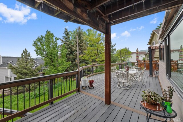 18 Blue Sage, Littleton, CO 80127 - wooden deck with outdoor dining area and a residential view
