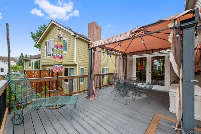 18 Blue Sage, Littleton, CO 80127 - wooden terrace with a gazebo, outdoor dining area, and french doors