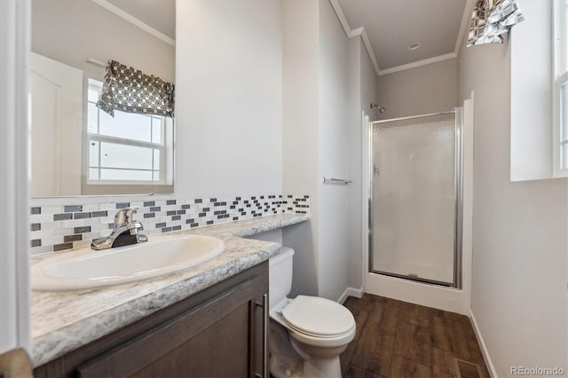 bathroom featuring a shower with shower door, hardwood / wood-style floors, tasteful backsplash, vanity, and crown molding