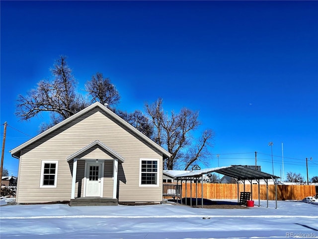 view of front of property featuring a carport