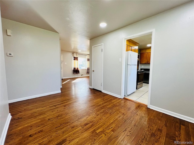 2027 S Newton St, Denver, CO 80219 - empty room with light wood-style floors, baseboards, and recessed lighting
