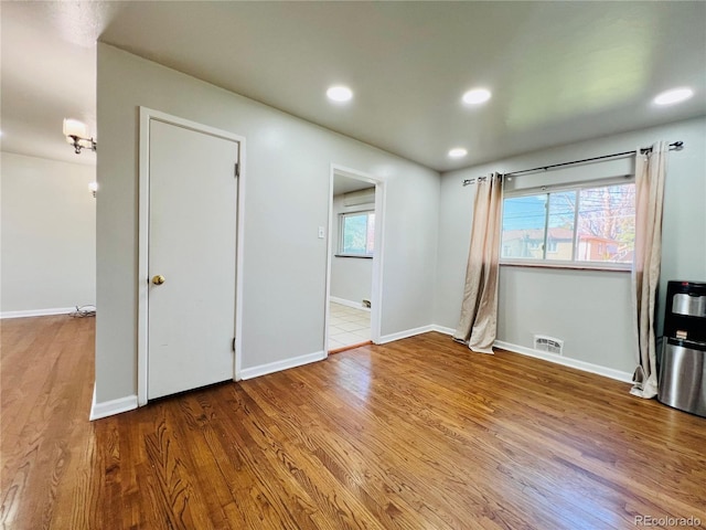 2027 S Newton St, Denver, CO 80219 - spare room with recessed lighting, visible vents, baseboards, and wood finished floors
