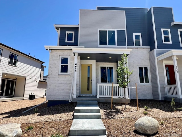 6648 N Nepal Ct, Aurora, CO 80019 - modern home with covered porch and central AC