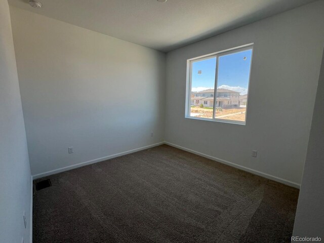 6648 N Nepal Ct, Aurora, CO 80019 - carpeted empty room featuring baseboards
