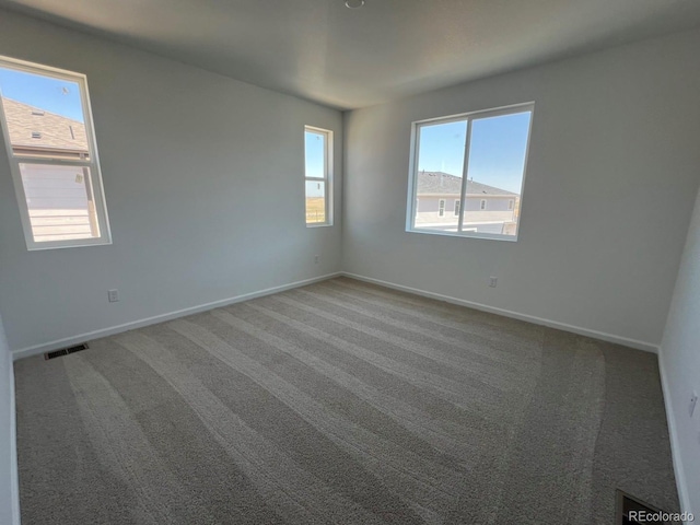 6648 N Nepal Ct, Aurora, CO 80019 - carpeted empty room featuring baseboards