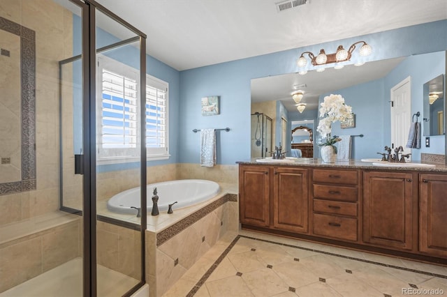 full bath featuring double vanity, a stall shower, a sink, and a bath