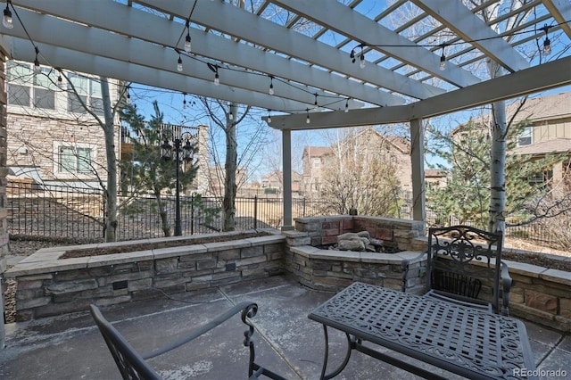 view of patio / terrace with a fire pit, fence, and a pergola