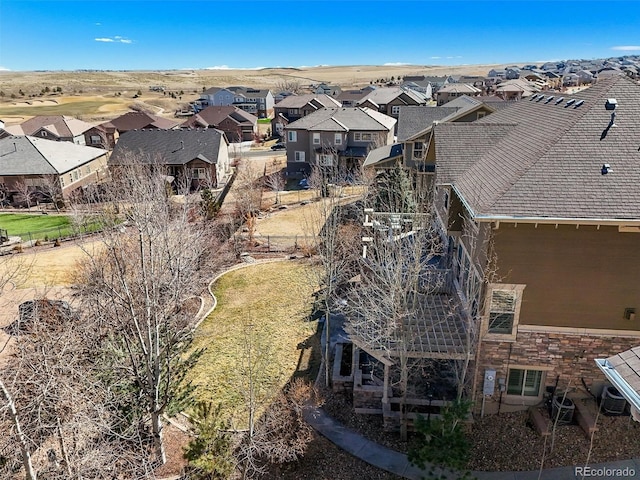 birds eye view of property with a residential view