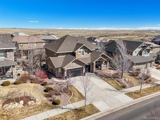 view of front of home featuring driveway and a residential view