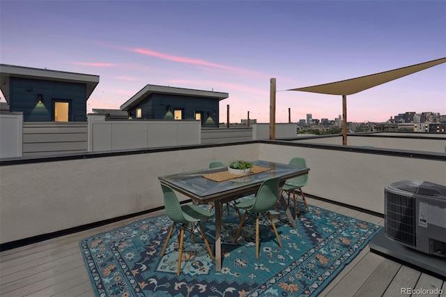 1836 Grove St Unit 108, Denver, CO 80204 - deck with central air condition unit, outdoor dining space, and a view of city