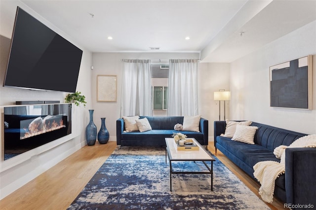 1836 Grove St Unit 108, Denver, CO 80204 - living area featuring wood finished floors, recessed lighting, and baseboards