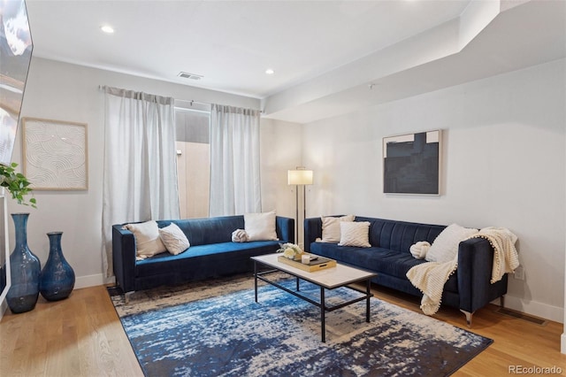 1836 Grove St Unit 108, Denver, CO 80204 - living room featuring baseboards, wood finished floors, and recessed lighting
