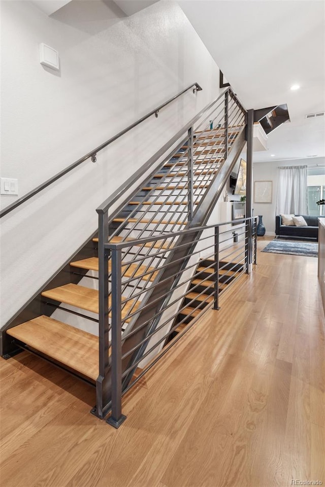 1836 Grove St Unit 108, Denver, CO 80204 - stairs featuring wood finished floors and recessed lighting