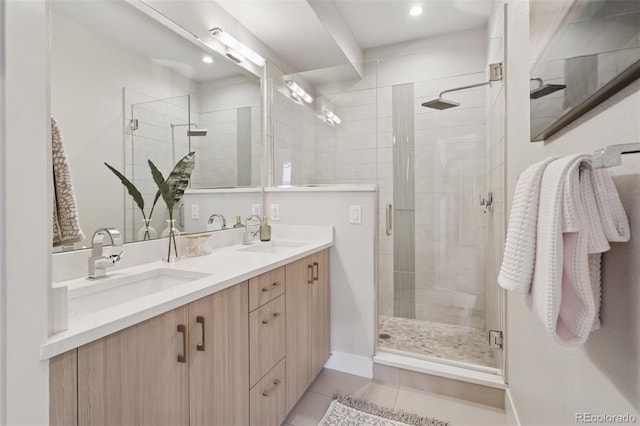 1836 Grove St Unit 108, Denver, CO 80204 - full bathroom with a stall shower, double vanity, tile patterned floors, recessed lighting, and baseboards