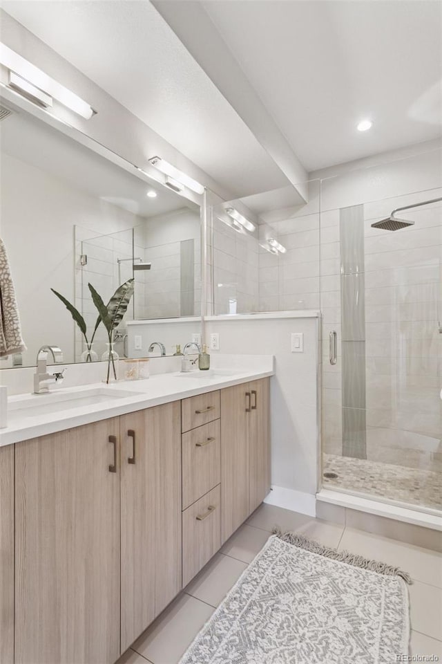 1836 Grove St Unit 108, Denver, CO 80204 - full bathroom with tile patterned flooring, a shower stall, and double vanity