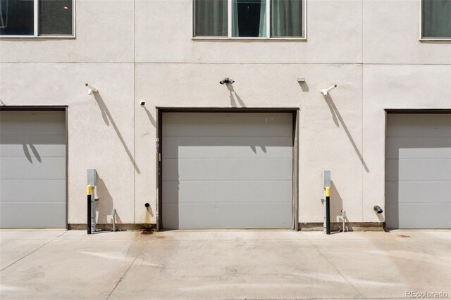 1836 Grove St Unit 108, Denver, CO 80204 - garage featuring driveway