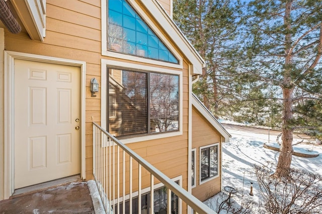 view of snow covered property entrance