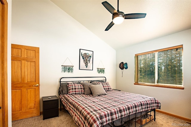 bedroom featuring a ceiling fan, carpet, vaulted ceiling, and baseboards